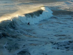 Surfer big wave Oceanside Pier