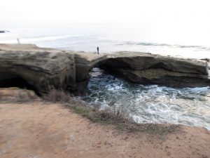 sunset cliffs natural park stone bridge over water