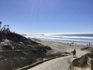 North Pacific Beach Ramp surfer walking ocean background