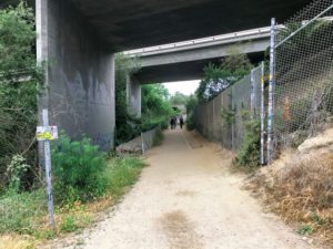 Under Freeway surfers walking